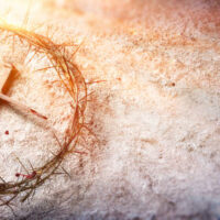 Calvary Of Jesus - Crown Of Thorns And Bloody Nails And Violet Robe On Ground With Sunlight