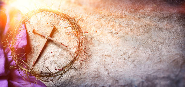 Calvary Of Jesus - Crown Of Thorns And Bloody Nails And Violet Robe On Ground With Sunlight